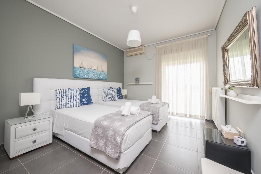 Light-filled boutique room with balcony at Villa Amfiario, Evia, Greece